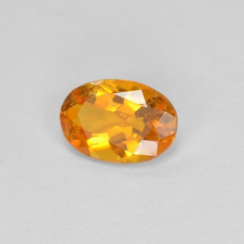 Clinohumite Abricot orange naturelle Coupe ovale, 0.60 ct, SI