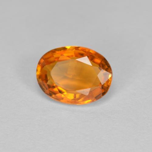 Clinohumite Orange moyen naturelle Coupe ovale, 0.81 ct, VS-SI