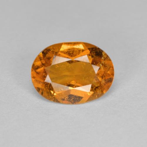 Clinohumite Orange moyen naturelle Coupe ovale, 1.21 ct, SI