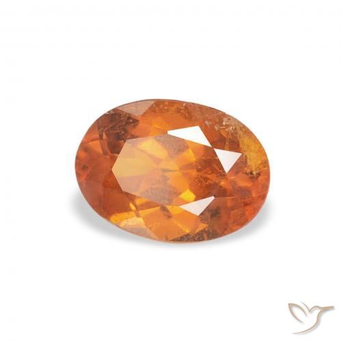 Clinohumite Orange foncé naturelle ovale, 0.89 ct, SI
