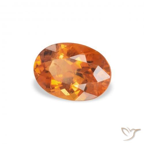 Clinohumite Orange moyen naturelle ovale, 0.70 ct, SI