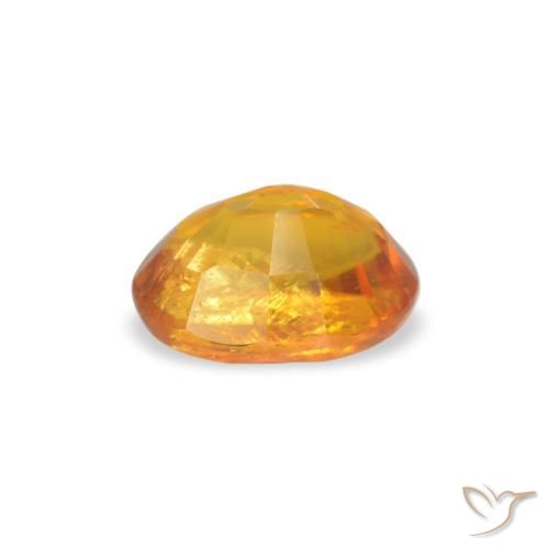 Clinohumite Orange moyen naturelle ovale, 0.66 ct, SI