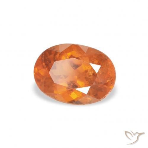 Clinohumite Orange foncé naturelle ovale, 0.87 ct, SI