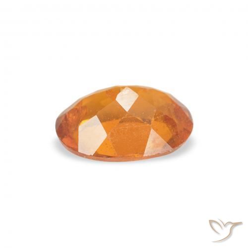 Clinohumite Orange rougeâtre naturelle ovale, 0.76 ct, SI