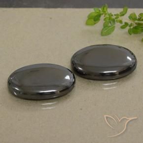 Shop natural 53.80ct Noir Gris Hématite gems, ovale, from Brésil at GemSelect. In stock, global shipping!