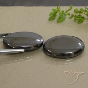 Shop natural 53.80ct Noir Gris Hématite gems, ovale, from Brésil at GemSelect. In stock, global shipping!