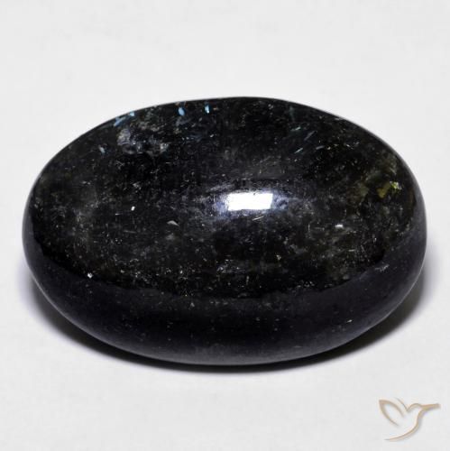 23.73ct Naturel Noir avec étincelle bleue Nuummite, ovale, Opaque