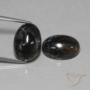 Shop natural 12.75ct Noire Pietersite gems, ovale, from Chine at GemSelect. In stock, global shipping!