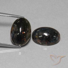 Shop natural 12.84ct Noire Pietersite gems, ovale, from Chine at GemSelect. In stock, global shipping!