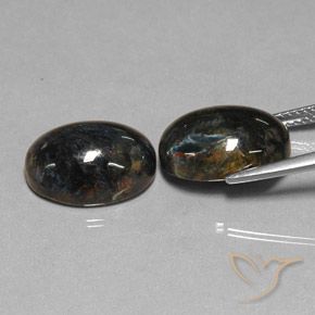 Shop natural 12.84ct Noire Pietersite gems, ovale, from Chine at GemSelect. In stock, global shipping!