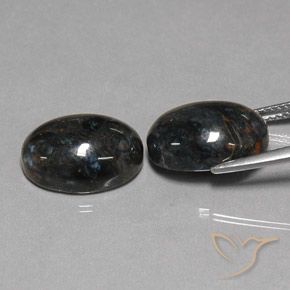 Shop natural 12.81ct Noire Pietersite gems, ovale, from Chine at GemSelect. In stock, global shipping!