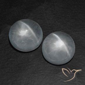 Shop natural 12.80ct Blanc clair Quartz Œil de Chat gems, Tour, from Inde at GemSelect. In stock, global shipping!