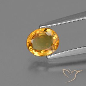 Saphir Doré-orange foncé naturelle ovale, 0.73 ct, VS