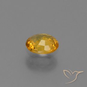 Saphir Doré-orange foncé naturelle ovale, 0.73 ct, VS