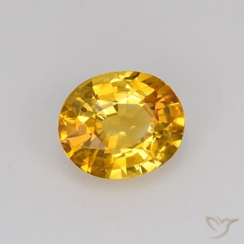 Saphir Or-orange moyen naturelle ovale, 0.84 ct, VS