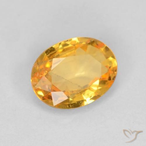 Saphir Orange-or moyen-léger naturelle ovale, 0.78 ct, VS
