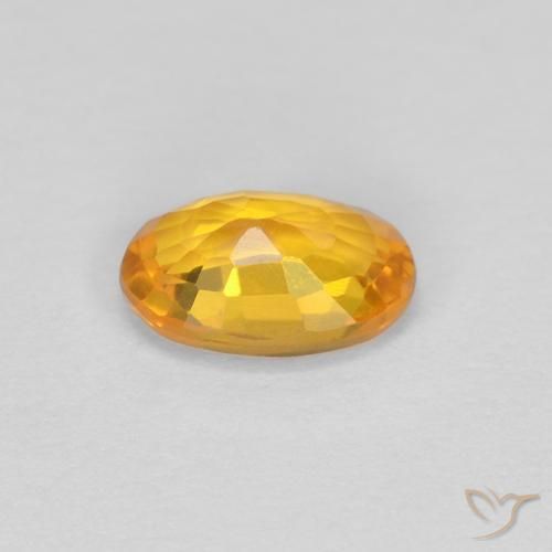Saphir Doré-orange foncé naturelle ovale, 0.62 ct, VVS