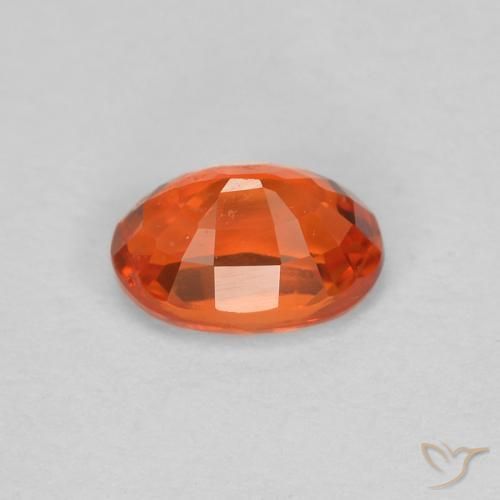 Saphir Orange rougeâtre naturelle ovale, 0.68 ct, VS