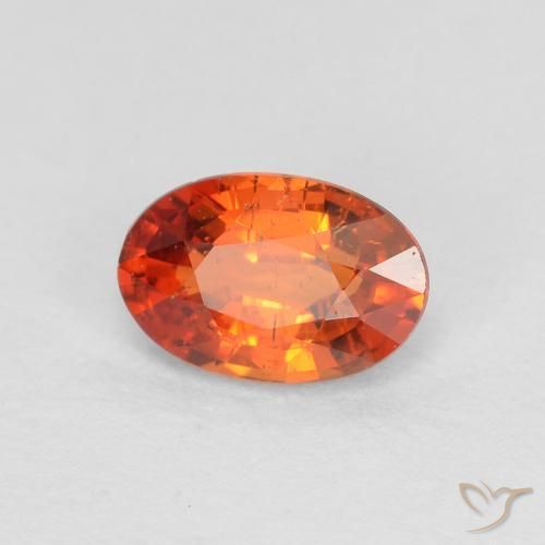 Saphir Orange rougeâtre naturelle ovale, 0.65 ct, VS