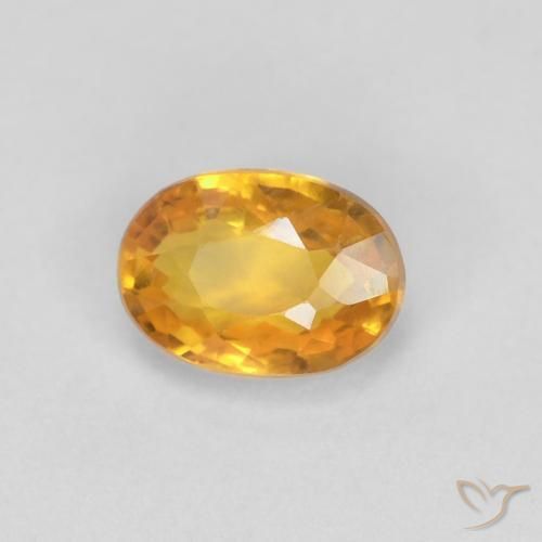 Saphir Or orange foncé naturelle ovale, 0.65 ct, VVS