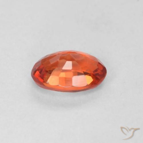 Saphir Orange rougeâtre naturelle ovale, 0.57 ct, VS