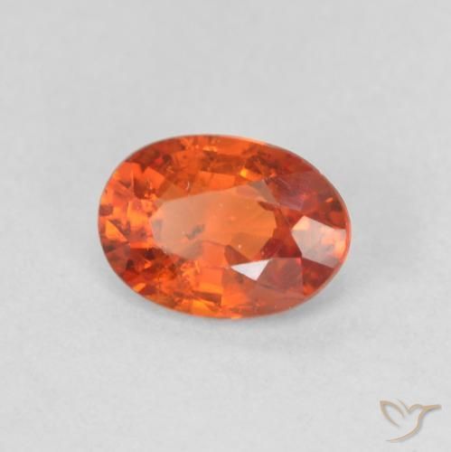 Saphir Orange rougeâtre naturelle ovale, 0.55 ct, VS