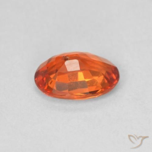 Saphir Orange rougeâtre naturelle ovale, 0.55 ct, VS