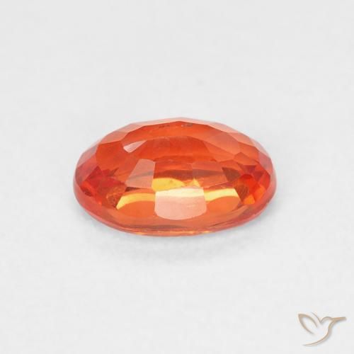 Saphir Orange rougeâtre naturelle ovale, 0.69 ct, VS
