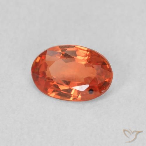 Saphir Orange rougeâtre naturelle ovale, 0.56 ct, VS