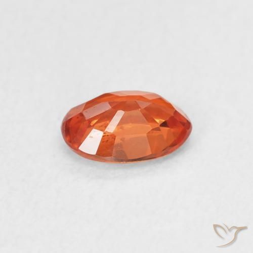 Saphir Orange rougeâtre naturelle ovale, 0.59 ct, VS