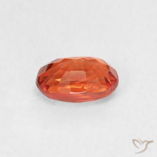 Saphir Orange rougeâtre naturelle ovale, 0.77 ct, VS