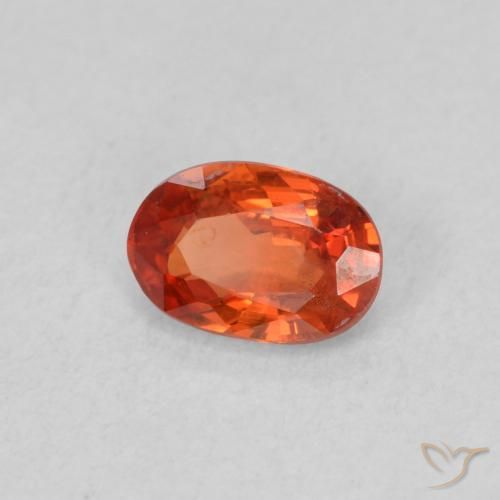 Saphir Orange rougeâtre naturelle ovale, 0.57 ct, VS