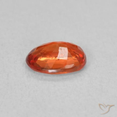 Saphir Orange rougeâtre naturelle ovale, 0.57 ct, VS