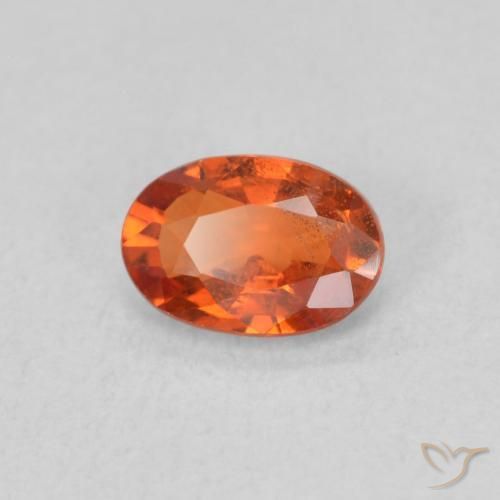 Saphir Orange rougeâtre naturelle ovale, 0.65 ct, VS