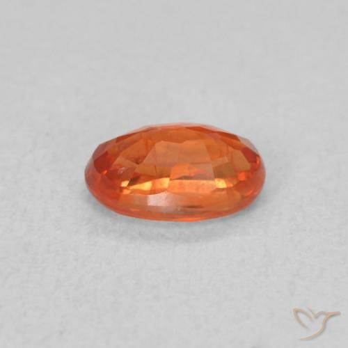Saphir Orange rougeâtre naturelle ovale, 0.71 ct, VS
