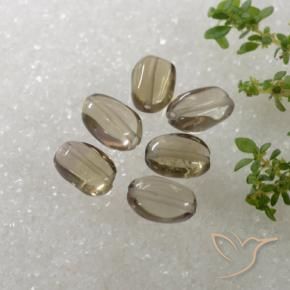 Achetez naturel 6.14ct Bois marron très clair Quartz fumé gems, Coupe ovale, En provenance Brésil chez GemSelect. En stock, livraison internationale!