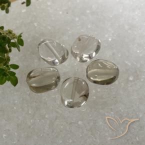 Shop natural 5.89ct Blanc brunâtre Quartz fumé gems, ovale, from Brésil at GemSelect. In stock, global shipping!
