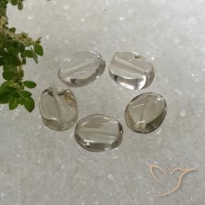 Shop natural 5.89ct Blanc brunâtre Quartz fumé gems, ovale, from Brésil at GemSelect. In stock, global shipping!