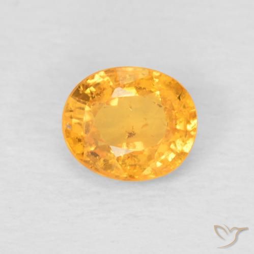 Grenat Spessartite Doré-orange foncé naturelle ovale, 0.52 ct, VS