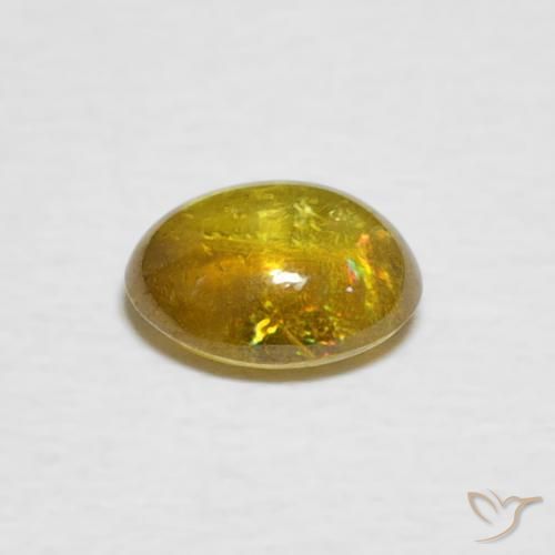 Sphène Jaune brunâtre naturelle ovale, 1.02 ct, Transparent