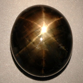Saphir étoilé noir naturelle coupe ovale, 24,91 ct, opaque