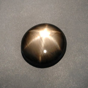 Saphir étoilé noir naturelle coupe ovale, 12,04 ct, opaque