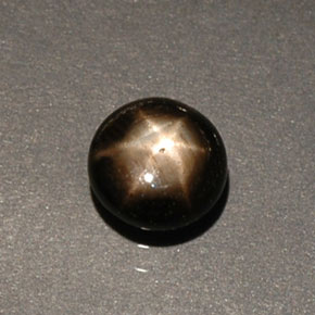 Saphir étoilé noir naturelle coupe roude, 0,60 ct, opaque