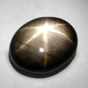 Saphir étoilé noir naturelle coupe ovale, 10,83 ct, opaque
