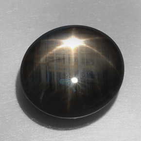 Saphir étoilé noir naturelle coupe ovale, 32,76 ct, opaque