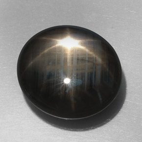 Saphir étoilé noir naturelle coupe ovale, 32,76 ct, opaque