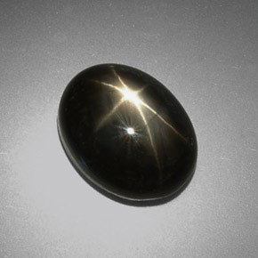 Saphir étoilé noir naturelle coupe ovale, 9,38 ct, opaque