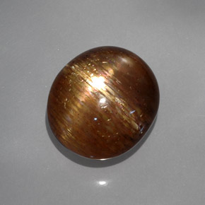 Pierre de soleil étoilée brun doré naturelle coupe ovale, 19,22 ct, opaque