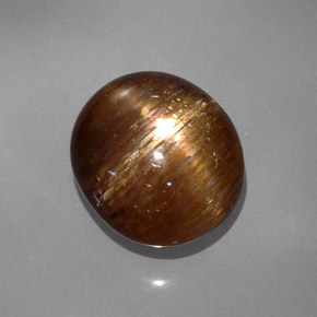 Pierre de soleil étoilée brun doré naturelle coupe ovale, 19,22 ct, opaque