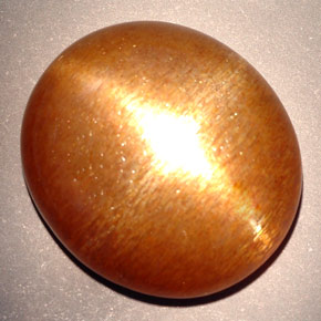 Pierre de soleil étoilée marron doré naturelle coupe ovale, 23,28 ct, opaque